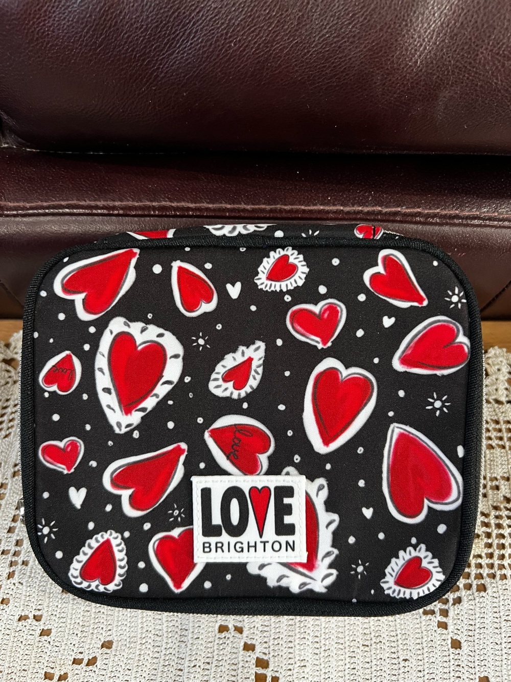 This is a Brighton Hearts A Flutter Jewelry case. NWOT